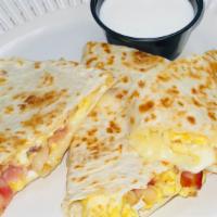 Bacon Quesadilla / Quesadilla De Tocino. · with_ flour tortilla bacon, egg, cheese, lettece , tomato, sour cream on top
con_tortilla de...