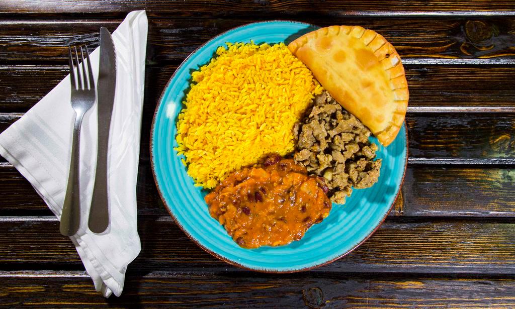Combo Platter · Our very own, high-quality - parboiled rice, homemade beans with your choice of marinated grilled pork or chicken, cooked to perfection, includes one EMPANADA