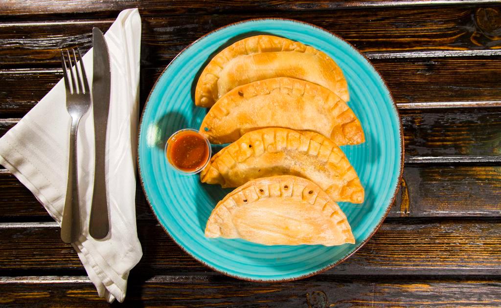 Frozen(Raw) -  Four Empanada Special · Frozen( raw) - Cook your own Empanadas! Air fry or bake them on your own. Mix and match any 4 Empanadas of your choosing. No special instructions.