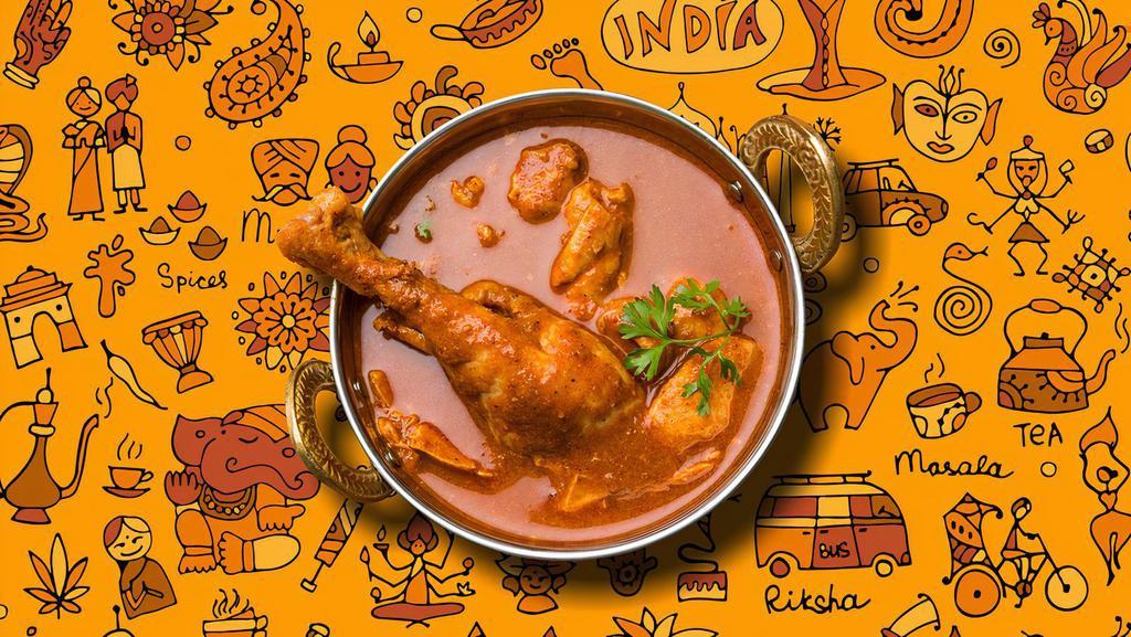 Railway Chicken Curry · Tender morsels of chicken cooked in a classic brown curry with Indian whole spices, served with a side of our aromatic basmati rice