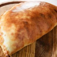 Paradise Calzone · Sausage, pepperoni, hamburger, green peppers, onions, mushrooms, and bacon.
