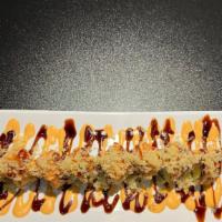 Lucky Roll · Shrimp tempura and avocado topped with spicy tuna and crunch, special sauce.