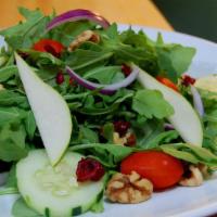 Baby Arugula Salad · Sliced pears, candied walnuts, goat cheese, dried cranberry, cherry tomatoes, red onions, an...