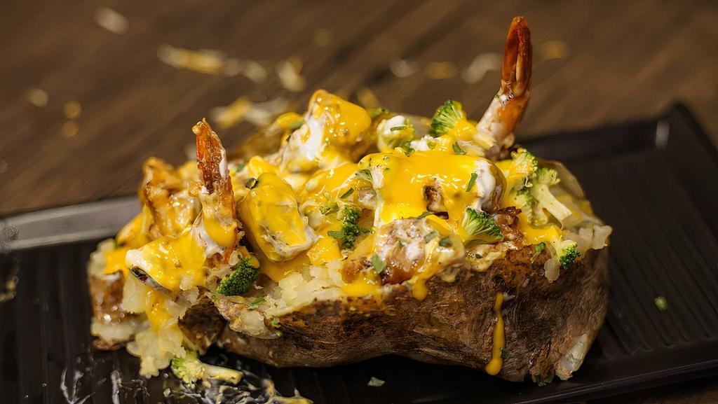 Shrimp & Chicken Loaded Potato · Baked Potato loaded with shrimp, chicken, broccoli and cheese