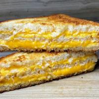Triplecheesy® · Loads of melted cheese grilled in between three slices of buttery topped classic white bread.