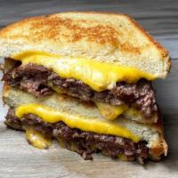 Grillcheesy Burger® · Cheese and burger inside a grilled thick sourdough bread