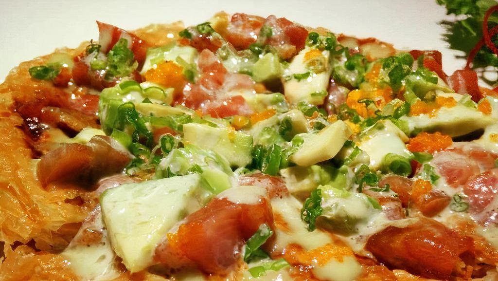 Sushi Pizza · Crispy crust pizza with tuna, salmon, white tuna & avocado.