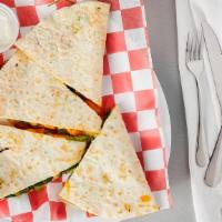 Wheat Spinach Quesadilla · Fresh spinach, red onions, mushrooms and Monterey jack cheese stuffed into a crisp whole whe...