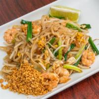 Pad Thai Noodles · Stir-fried Thai noodles with egg, bean sprouts, dry tofu and topped with ground peanuts and ...