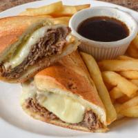 French Dip · Sliced steak with melted mozzarella on a garlic club roll with au jus Served w/ Fries