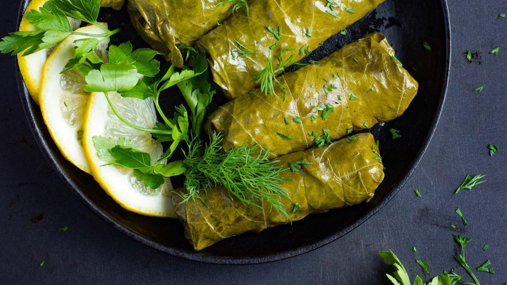 Grape Leaves · 8 pieces: all vegetarian stuffed grape leaves with rice and vegetables.