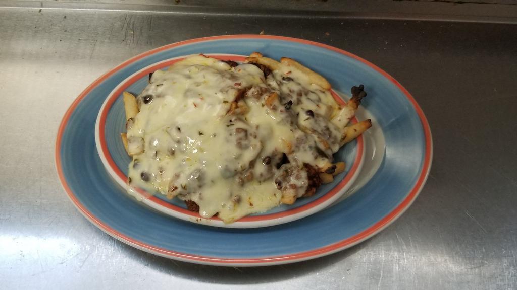 Disco Fries · French fries topped with gravy and melted mozzarella cheese.