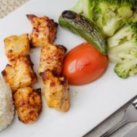 Chicken Shish Kebab · Char-grilled marinated chunks of chicken, served with grilled vegetables and rice.