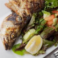 Branzini (Sea Bass) · Grilled whole fish of Mediterranean sea bass drizzled with lemon juice and olive oil, served...