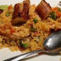 Arroz Con Pollo · Rice with chicken and vegetables.