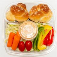 Bagel Box · Two mini bagels, tuna and egg, fresh sliced vegetables and russian dressing.