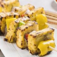 Paneer Tikka · Indian cottage cheese, onion and bell pepper marinated with yogurt and spices grilled in tan...