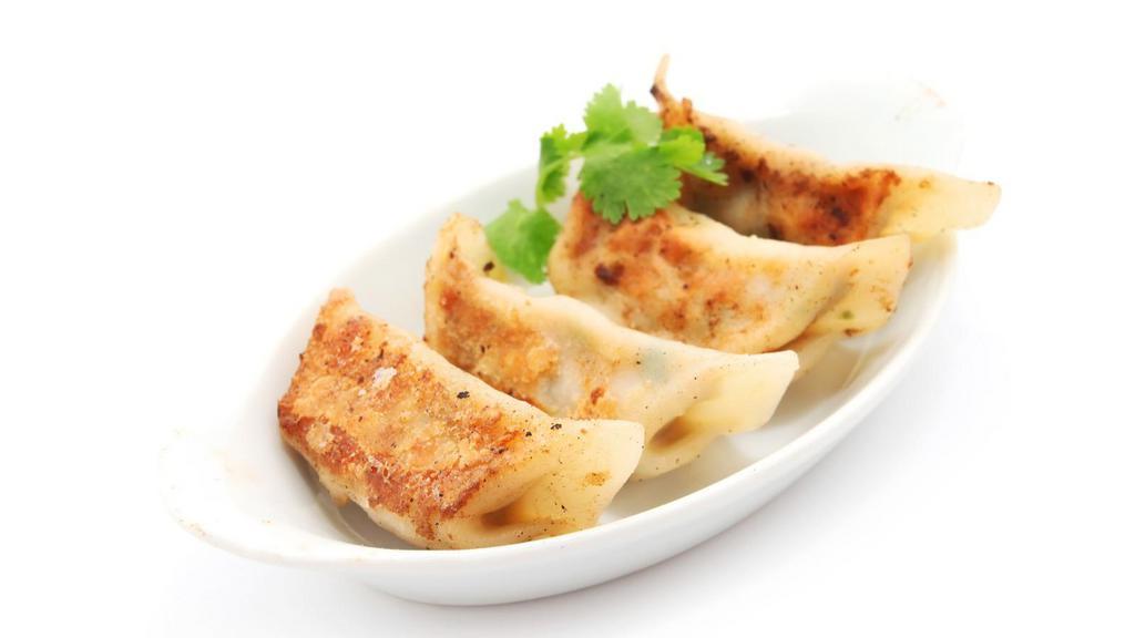 Shrimp Dumplings · Tender dumpling dough stuffed with fresh shrimp, green onions and unique umami flavours, steamed to perfection and served with a side of our gluten free Shoyu sauce.