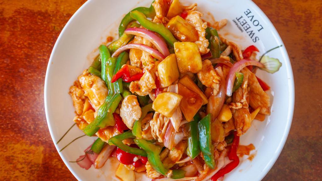 Mango Chicken · Fresh mango, red onions, pepper, sweet peas, with sweet and sour sauce.
