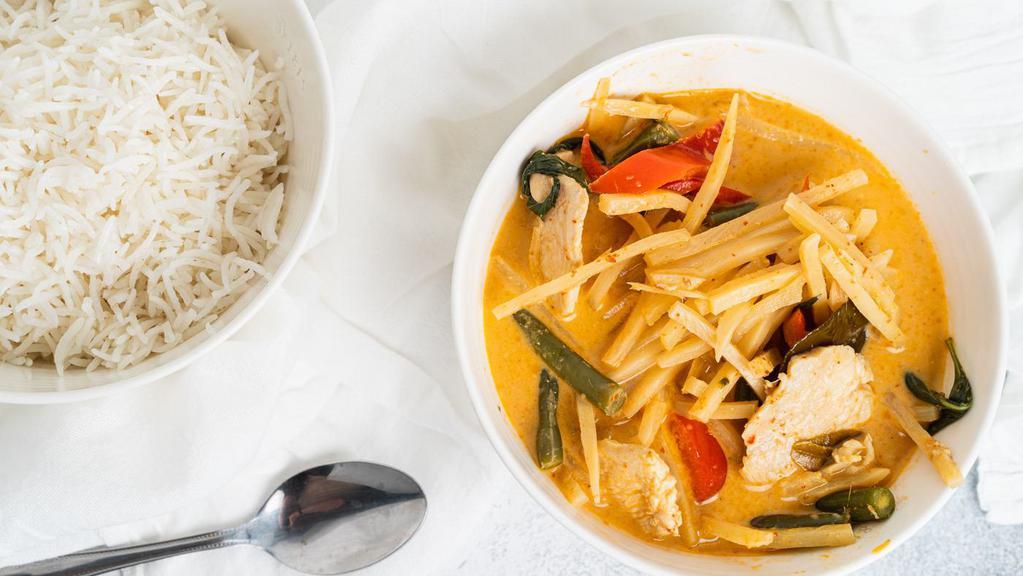 Red Curry · Spicy. With coconut milk, bamboo shoot, string bean, bell pepper and Thai basil.