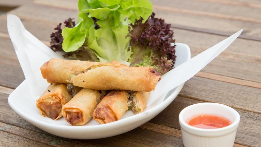 Chicken Spring Rolls · Golden chicken fried spring rolls with sweet and chilli sauce.