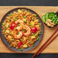 Pineapple Fried Rice · Exquisite pineapple flavored fried rice with vegetables, raisins and cashew nuts.