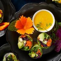 Mango-Avocado Roll (12 Bite) · Organic spring-mix, fresh ginger, carrots, red cabbage, cucumber, cilantro, wrapped in rice ...