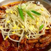 Bean Sprout Chicken Feet · Chicken feet in spicy soup with bean sprout and clear noodles on top.