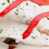Canelones · Spinach and shrimp cannelloni with tomato and bechamel sauce