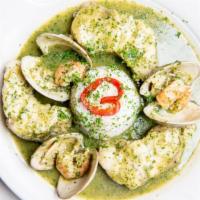 Rape En Salsa Verde · Sauteed monkfish in a parsley and garlic sauce with clams and shrimp