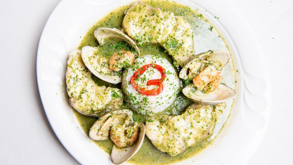Rape En Salsa Verde · Sauteed monkfish in a parsley and garlic sauce with clams and shrimp