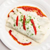 Canelones De Espinacas Y Gambas · Cannelloni of spinach and shrimp with tomato and bechamel sauce