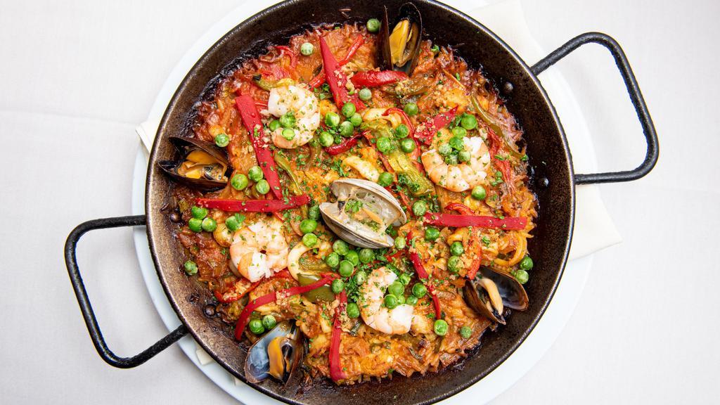 Paella De Mariscos · Paella with squid, shrimp, prawn, clams, monkfish and mussels