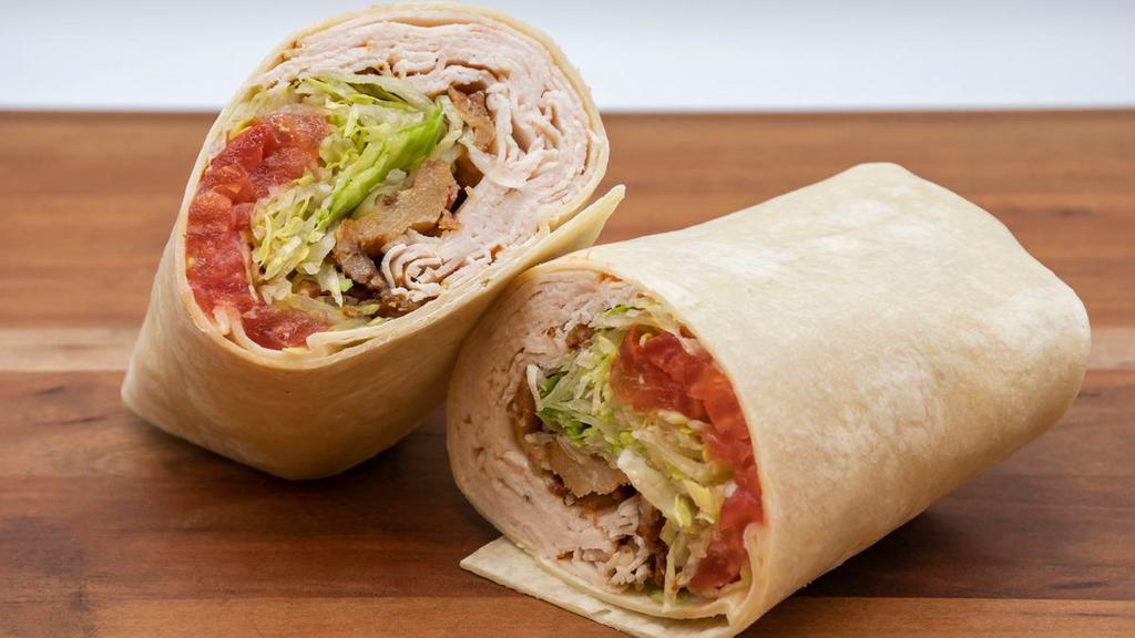 Turkey Blt Wrap · Boars head oven gold turkey, bacon, lettuce, tomato, and mayo in a flour wrap.