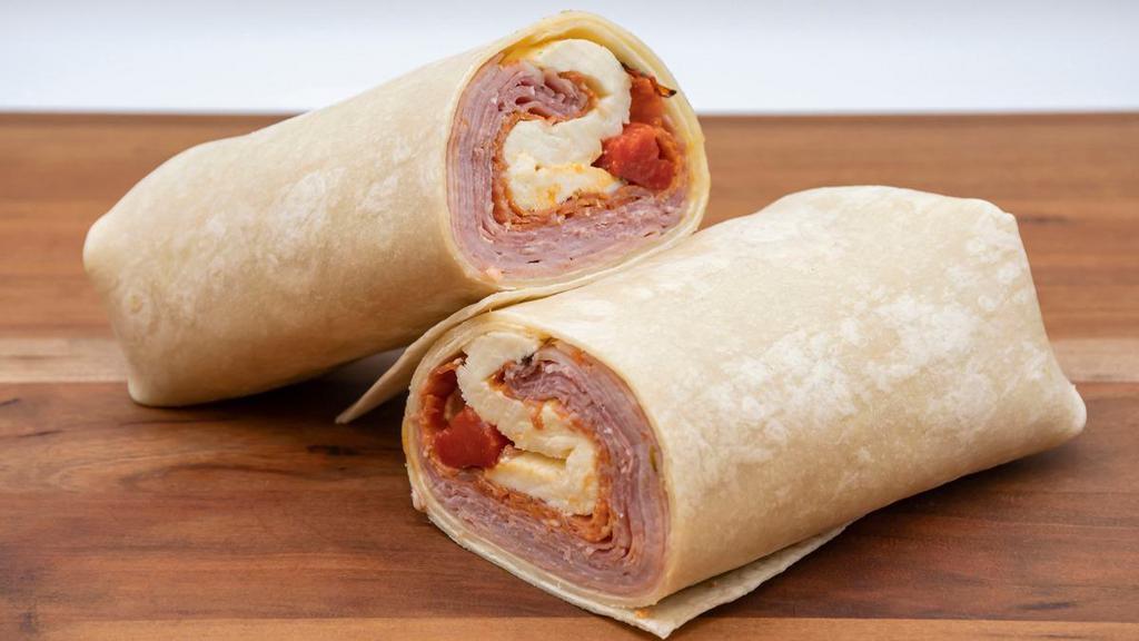 Italian Wrap · Ham cappy, hormel dilusso salami, hormel slicing pepperoni, mortadella, mozzarella, roasted red peppers in a four wrap.