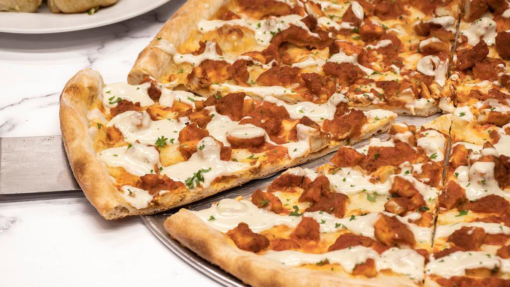 Buffalo Chicken Pizza · Whole pie topped with breaded chicken cutlet smothered in buffalo wing sauce and mozzarella.
