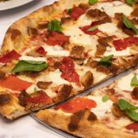 Uncle G'S Pizza · Whole pie topped with chicken cutlet, fresh mozzarella, basil, roasted peppers, shredded moz...