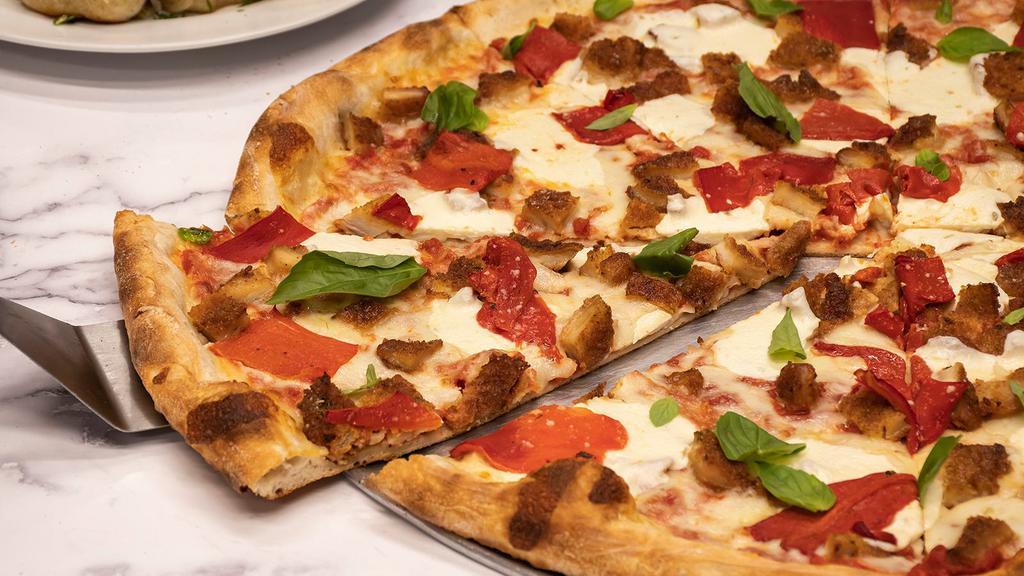 Uncle G'S Pizza · Whole pie topped with chicken cutlet, fresh mozzarella, basil, roasted peppers, shredded mozzarella and tomato sauce.