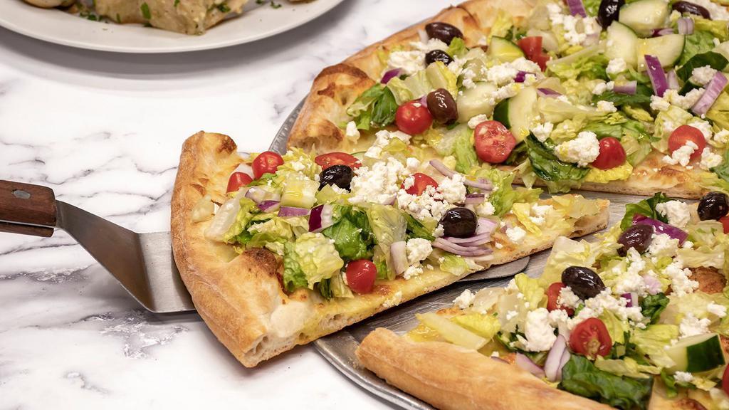 Greek Salad Pizza · Iceberg lettuce, tomato, red onion, olives, cucumber and feta cheese.