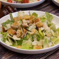Caesar Salad · Chopped romaine, parmesan cheese, homemade croutons and caesar dressing.