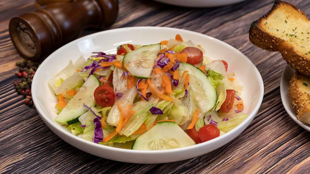 Garden Salad   · Chopped romaine, cucumbers, tomatoes, onions with our homemade Italian dressing.