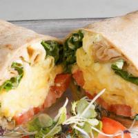 Brekkie Wrap · 2 scrambled cage free eggs, tomato, Swiss cheese, lettuce with house herb mayo on a wholewhe...