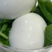 Swag Protein · 2 hard boiled cage free eggs in a bed of raw baby spinach