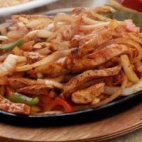 Fajitas · Your Meat selection sautéed with Peppers, onions, tomatoes