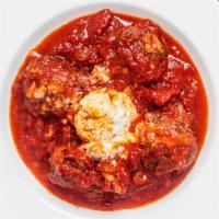 Polpette · Veal, beef, meatballs fire roasted and slowly cooked in our signature tomato sauce and sprin...