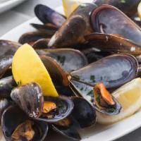 Mussels  · Garlic white wine or Spicy tomato sauce 
Pick one