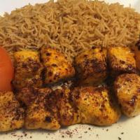 Chicken Kabob · Two skewers of separated boneless chicken breast marinated in our special house seasoning.