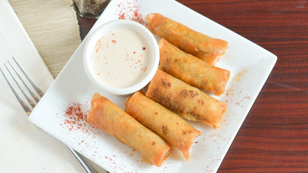 Beef Morrocan Cigars · Rolled phyllo dough filled with beef  served with tahini sauce.