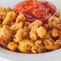 Riptide Calamari · Get ready for a flavor wave. Lightly breaded and fried calamari served with marinara sauce f...