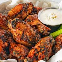 Gridiron Wings · Marinated in flavor and heat, these 10 chicken wings are crispy-skinned from a rub of Cajun ...